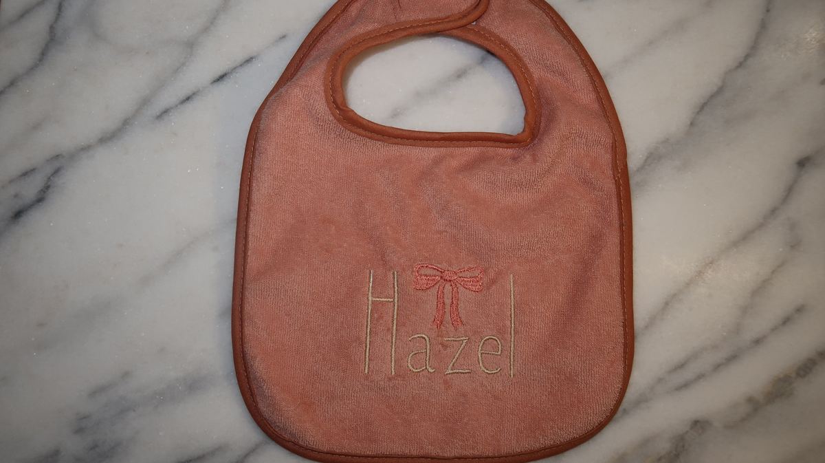 Personalized pink bib — Hazel with bow