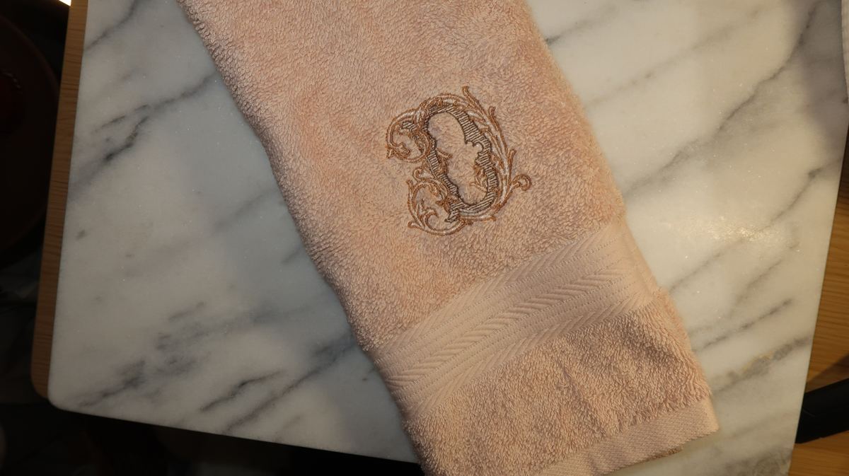 Blush towel — ornate D monogram