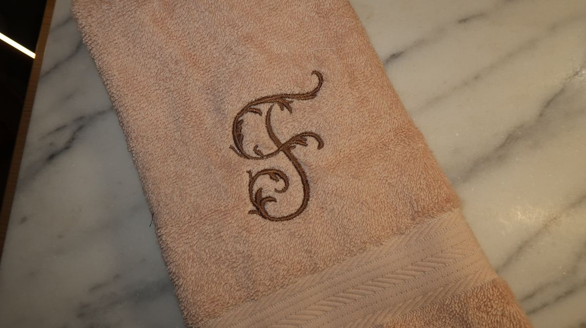 Blush towel — ornate S monogram